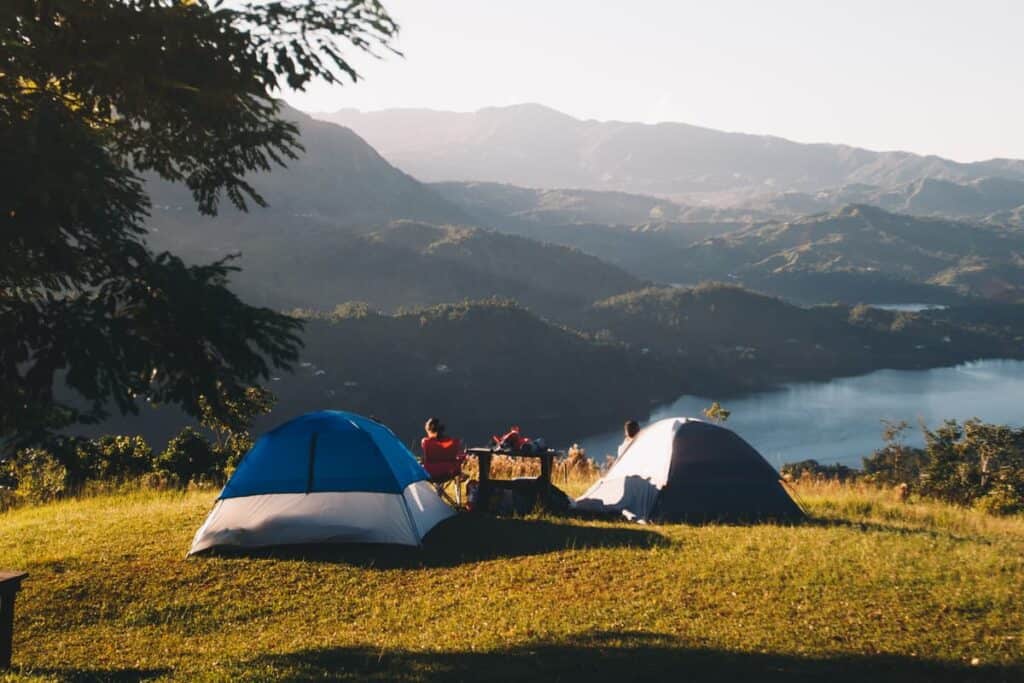 camping tents overlooking mountains and lake
